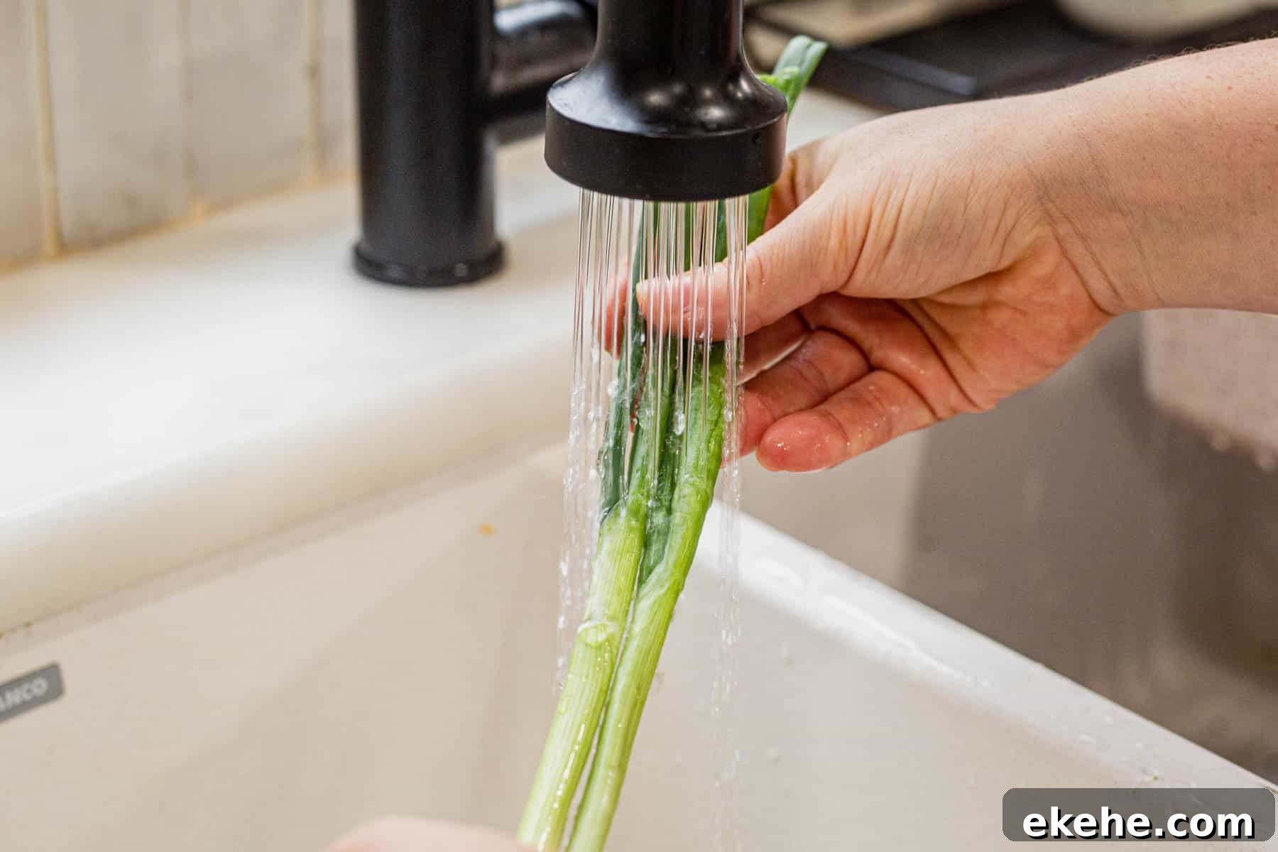 rinsing green onions under water