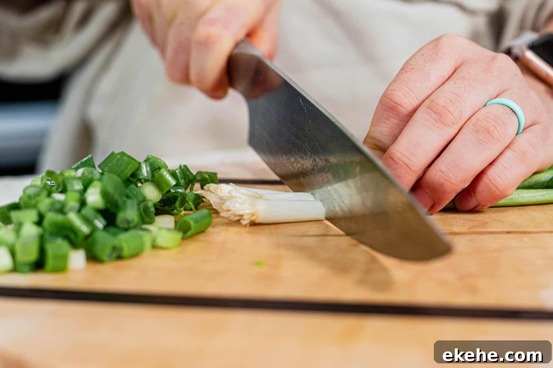 cutting the roots off of green onions