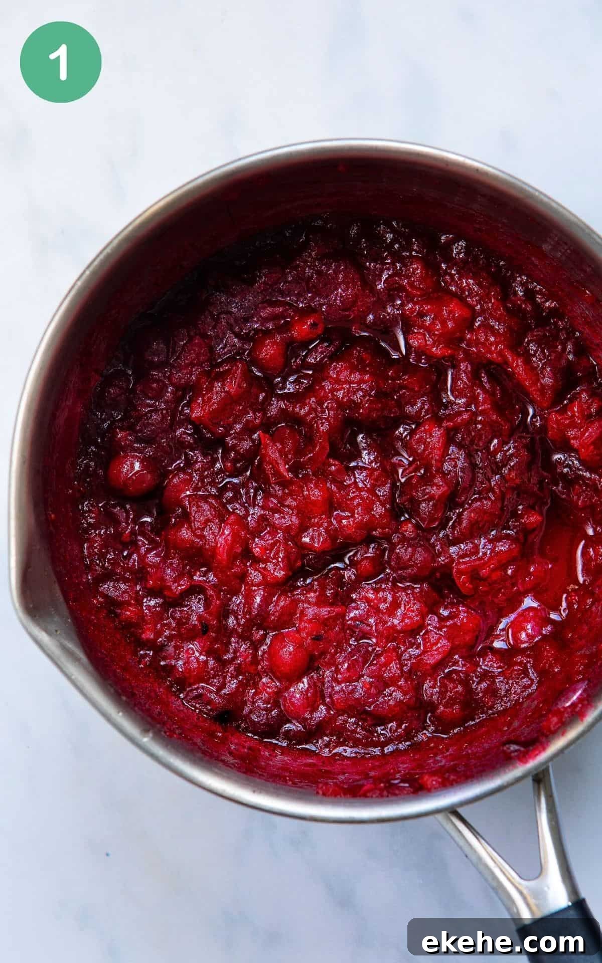 Overhead image of a pot of homemade cranberry sauce.
