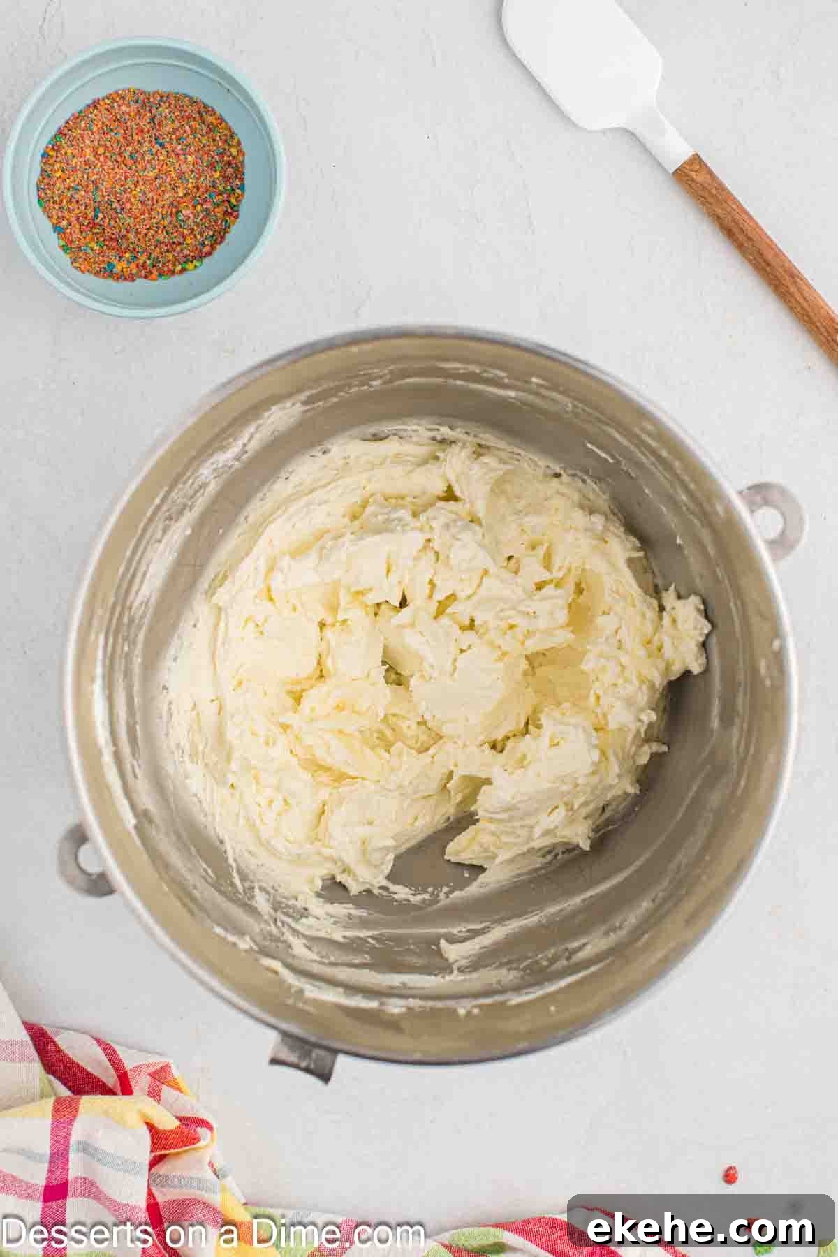 Mixing bowl with frosting ingredients combined. 