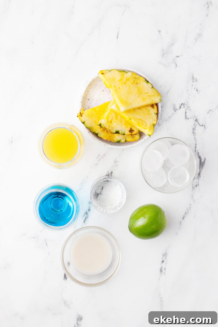 ingredients needed to make a blue hawaiian drink on a marble counter