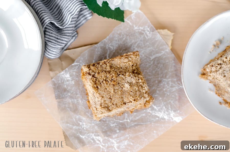 top down view of a slice of gluten-free chai coffee cake on a piece of parchment paper