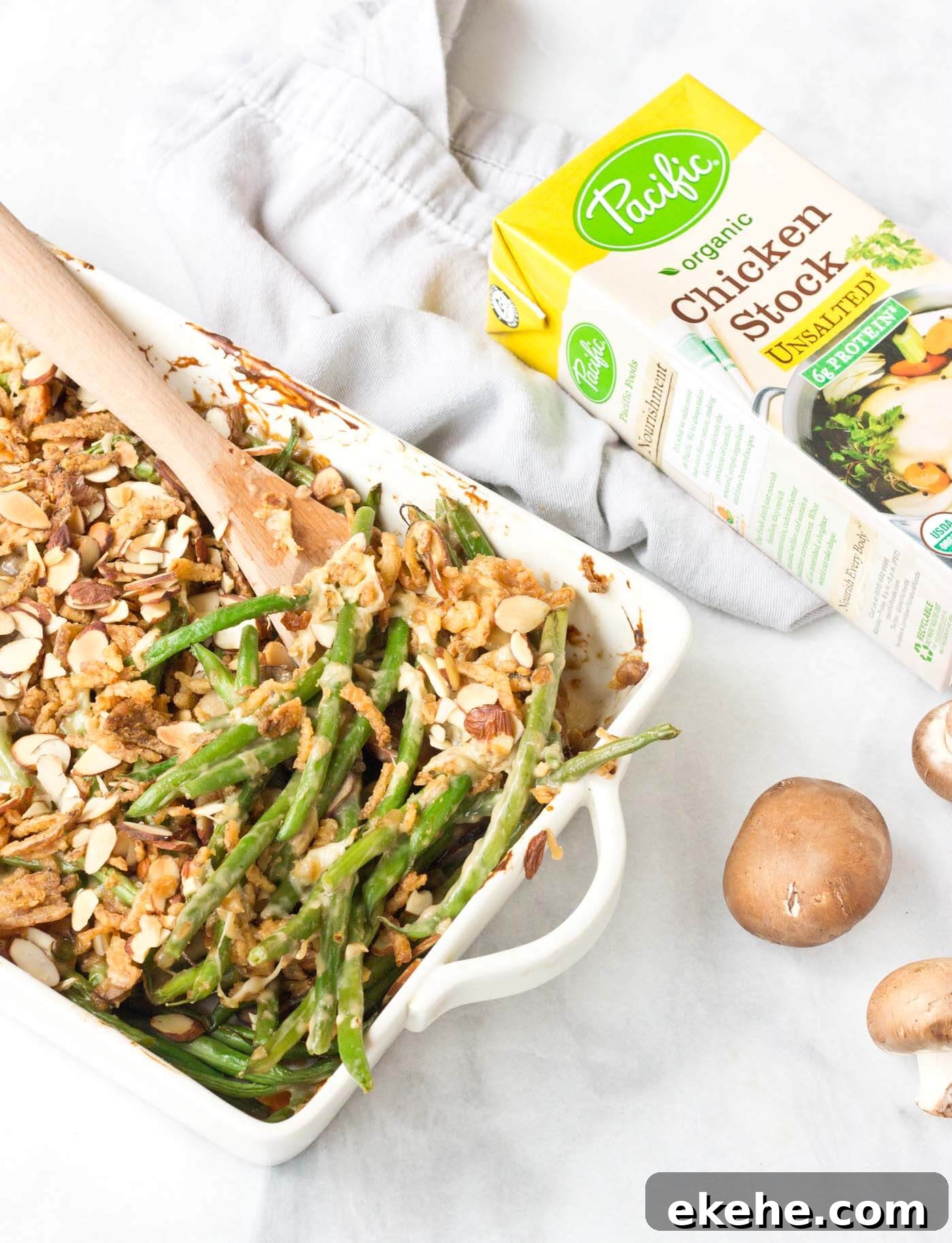 Because we all need Green Bean Casserole in our lives. This recipe is easy and made with homemade cream of mushroom soup + au gratin topping! Extra crunchies, please!
