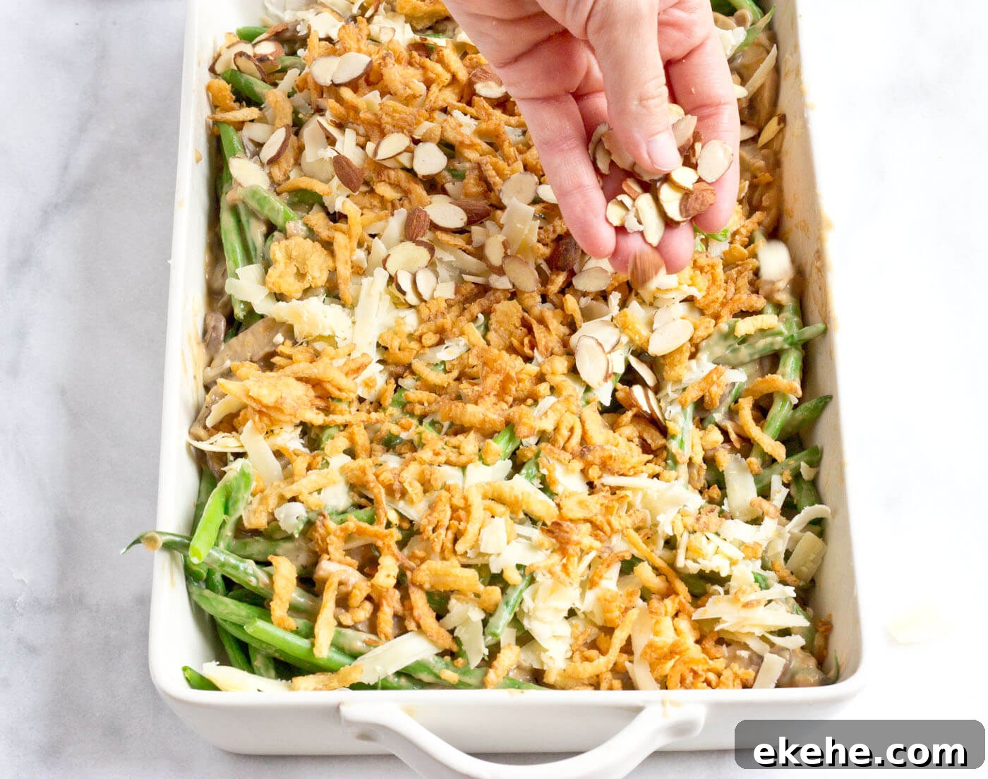 Because we all need Green Bean Casserole in our lives. This recipe is easy and made with homemade cream of mushroom soup + au gratin topping! Extra crunchies, please!