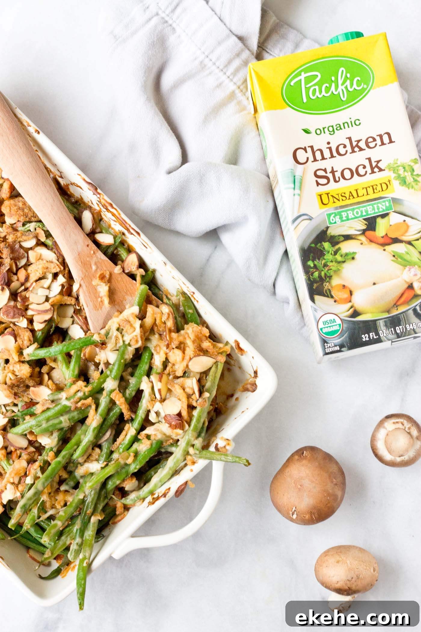 Because we all need Green Bean Casserole in our lives. This recipe is easy and made with homemade cream of mushroom soup + au gratin topping! Extra crunchies, please!