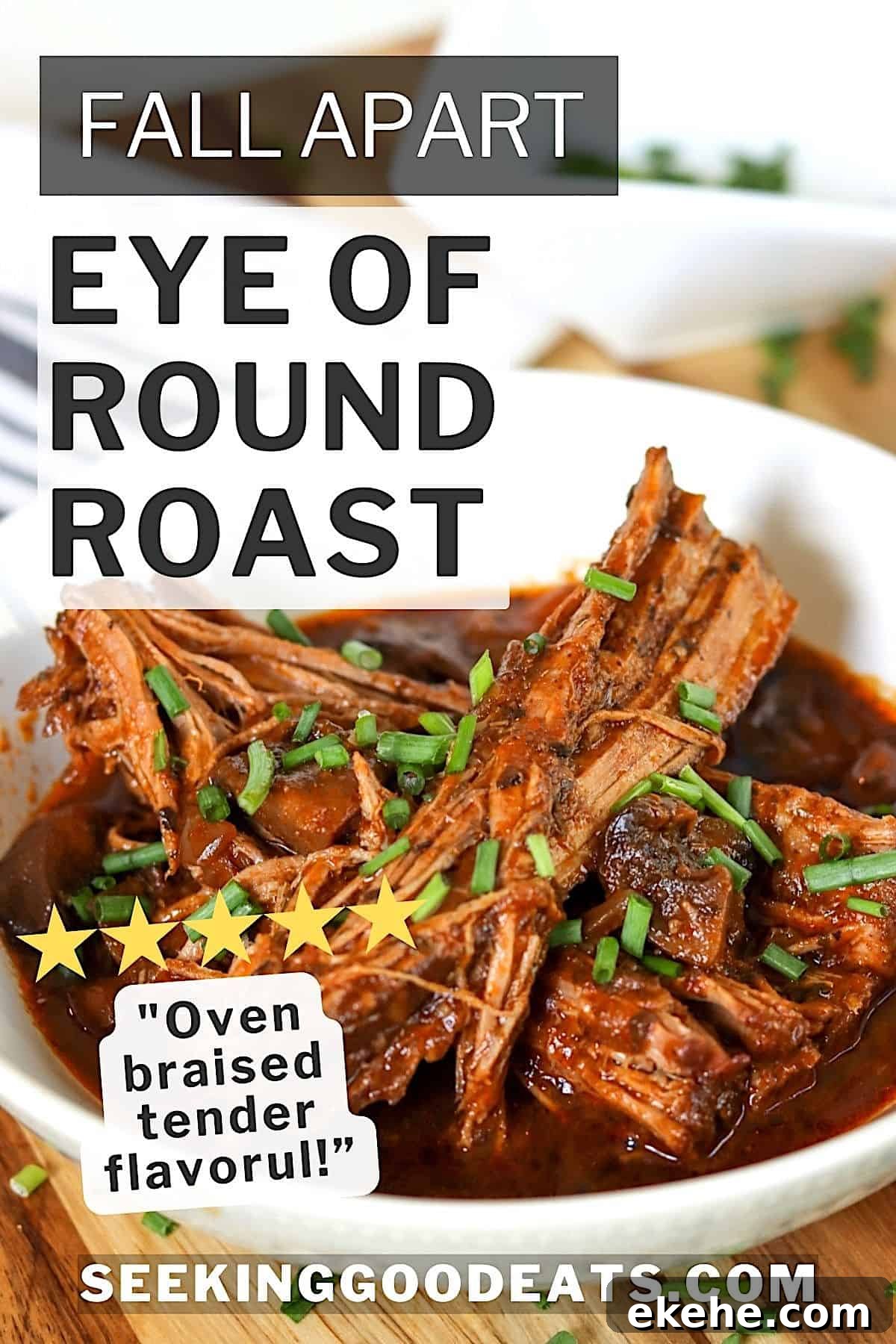 Eye of round roast pulled into pieces and covered in pot juices in a white bowl.