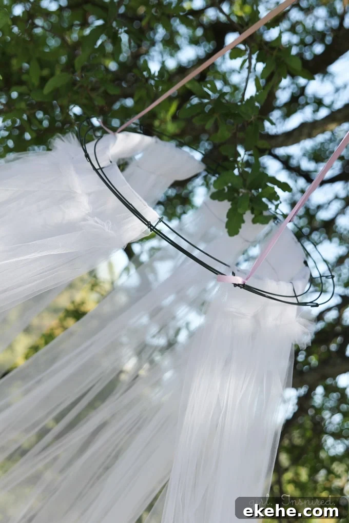 Hanging Tulle Tent - great for entertaining little guests or creating a fun focal spot in the yard