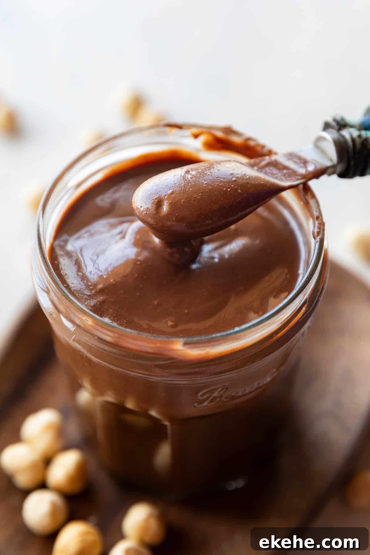Homemade Nutella chocolate spread in a jar with spoon