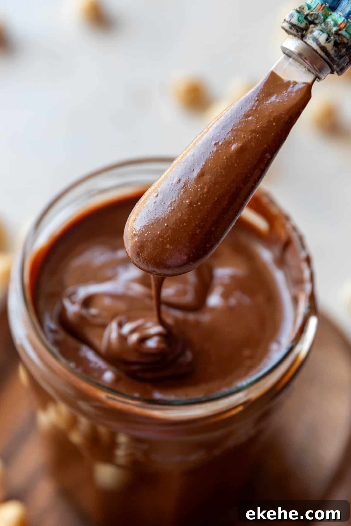 Homemade Nutella chocolate spread in a jar with spoon