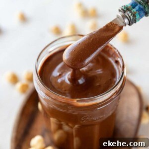 Homemade Nutella chocolate spread in a jar with spoon