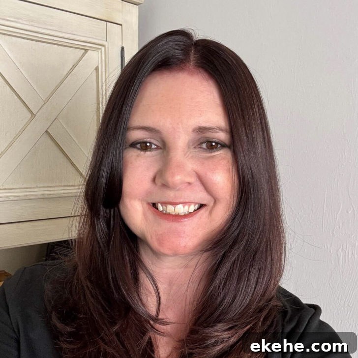 Photo of Kimberly Vargo in front of a bookcase.