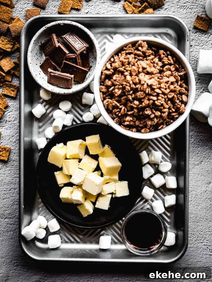 ingredients to make s'mores Rice Krispies treats on a sheet tray