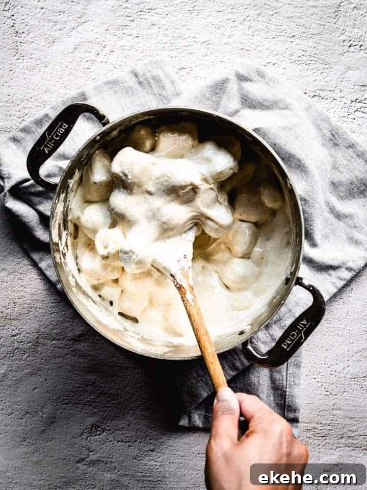 melting marshmallows with brown butter to make s'mores Rice Krispies