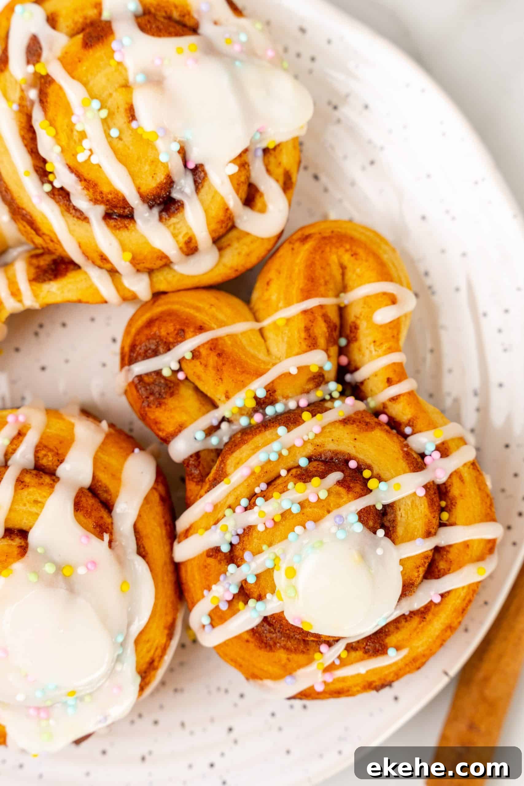 Easter bunny cinnamon buns on a white speckled plate