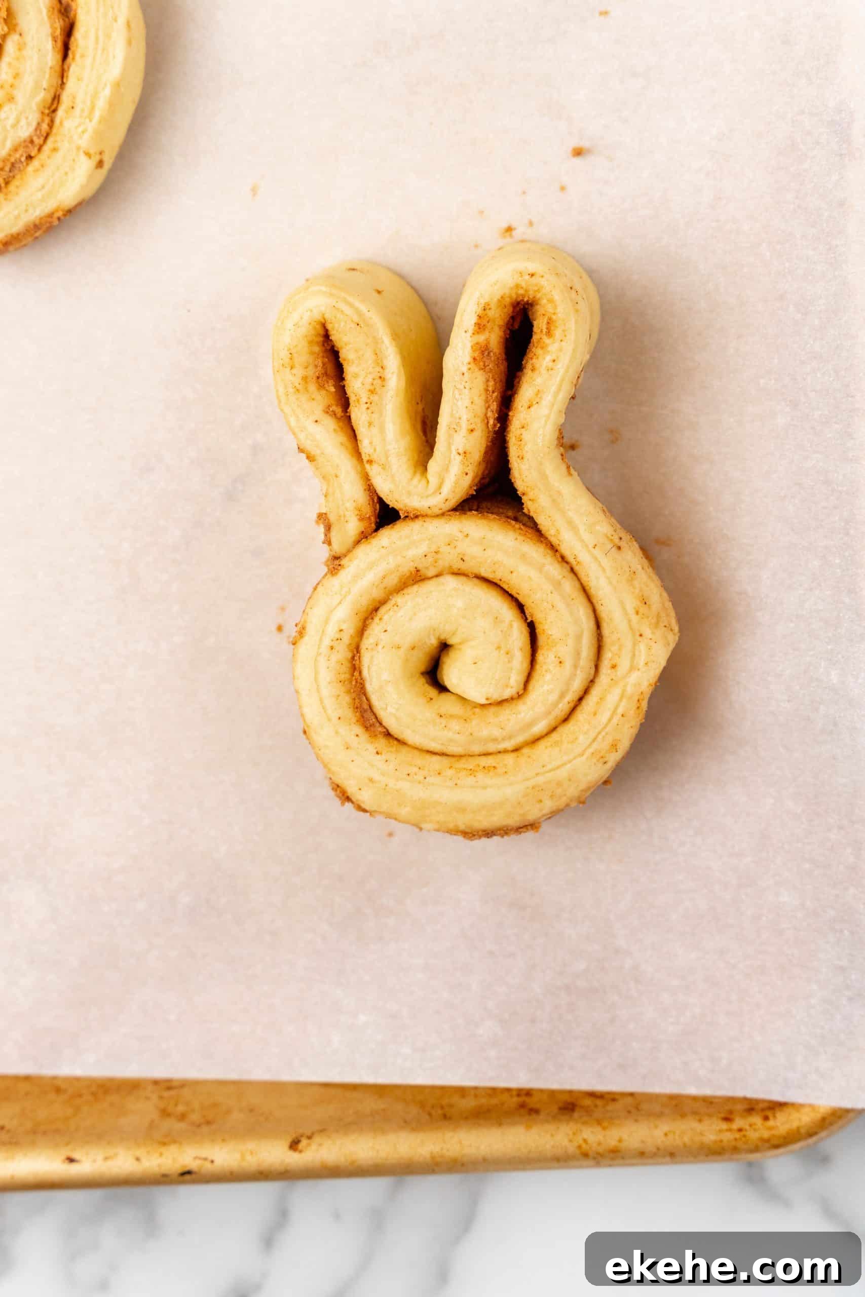 Easter bunny cinnamon rolls on parchment paper