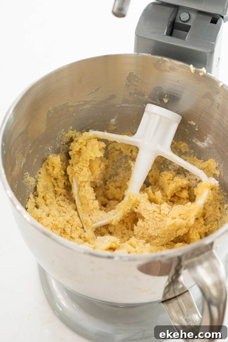 Crumble dough in a stand mixer.
