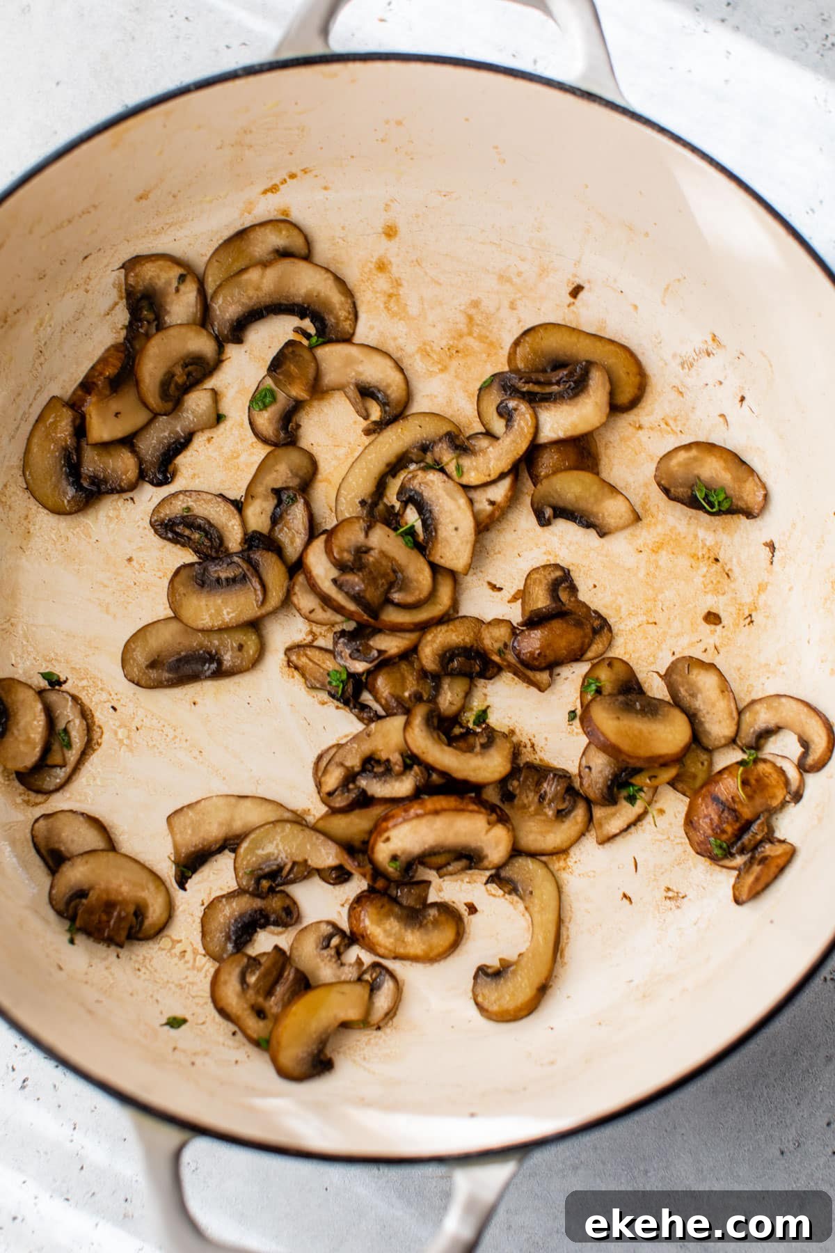 mushrooms sautéing in a dutch oven