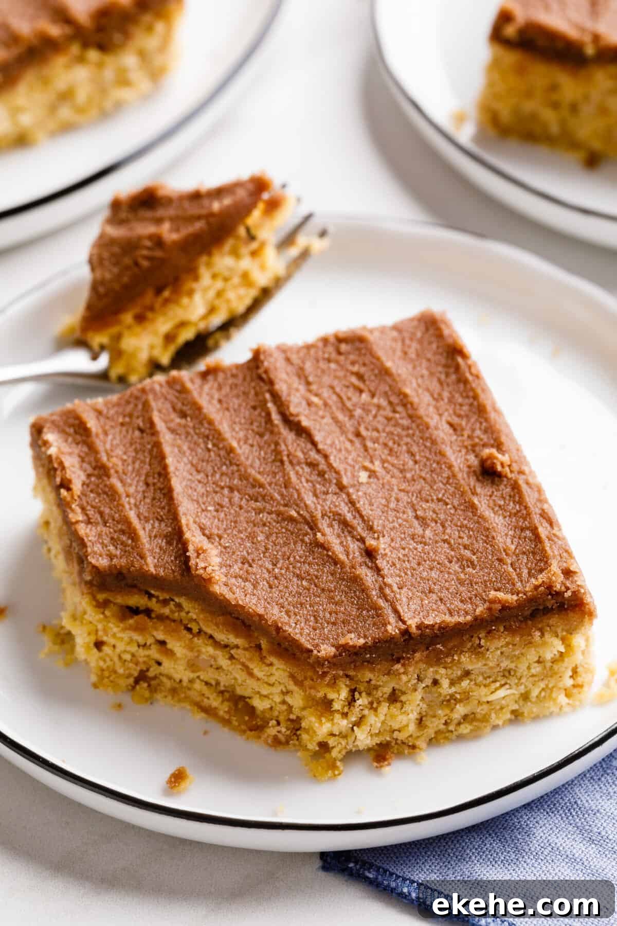 serving of lunch lady bar served on a white round plate with a forkful of the dessert