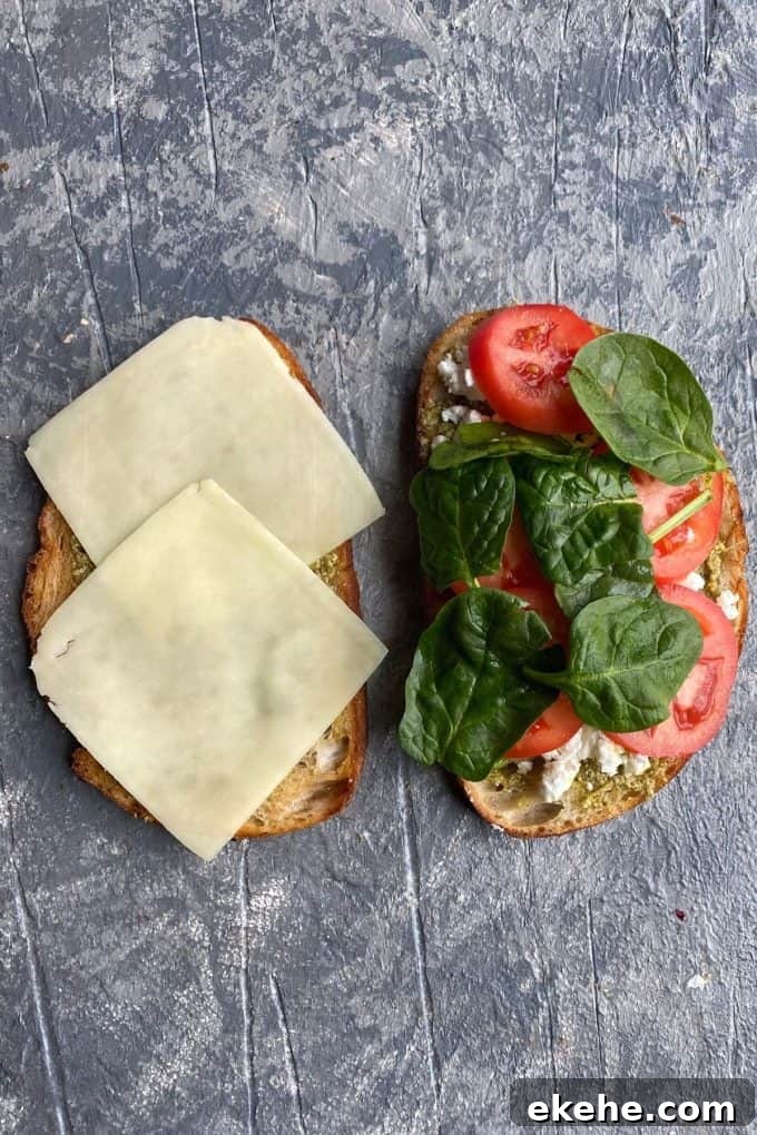 Sourdough slices with muenster cheese, tomato slices and spinach