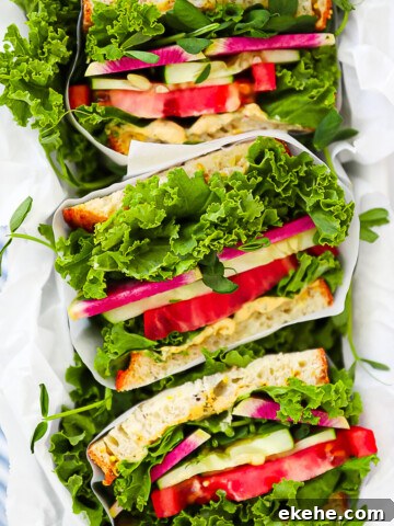 An overhead shot of sliced vegetarian sandwiches.