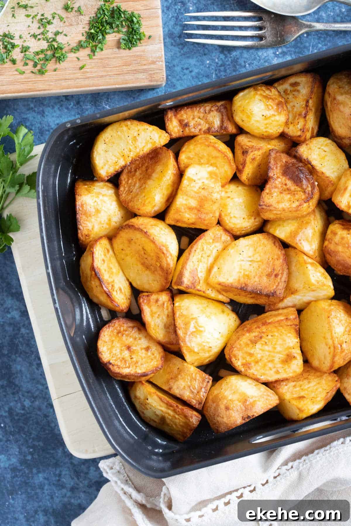 Roast potatoes in an air fryer basket.