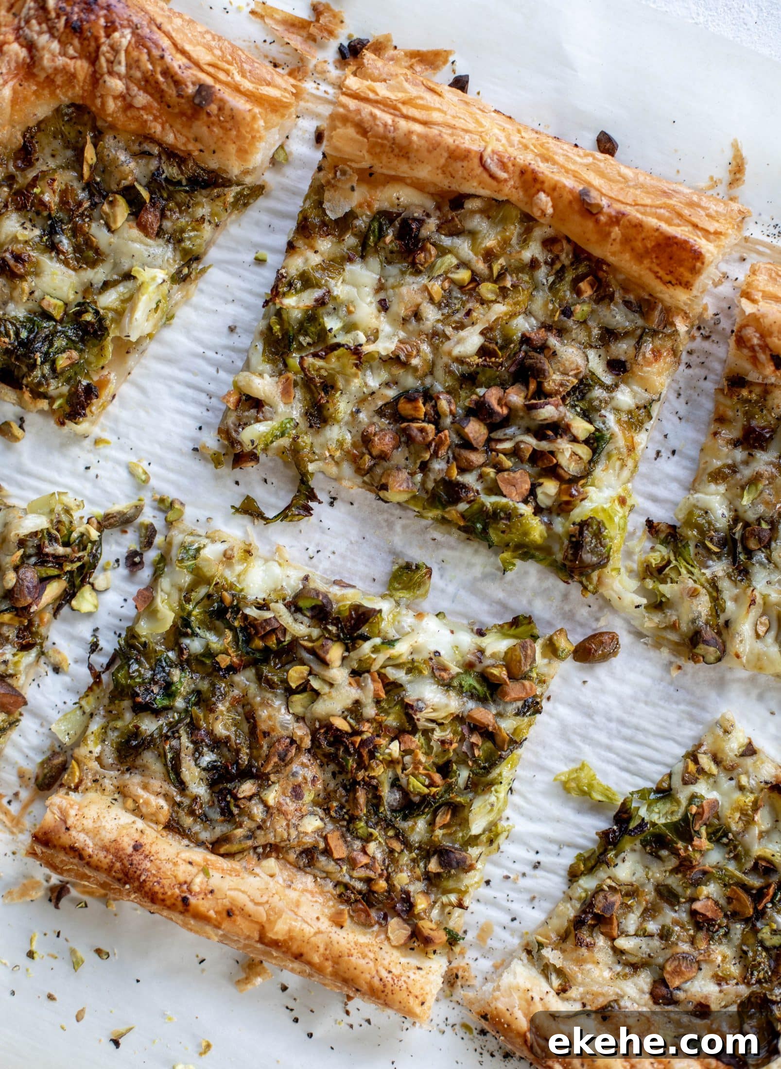 This brussels sprouts tart has a ton of flavor! Melty fontina, sliced brussels and crunchy pistachios all on top of puff pastry. Delish!