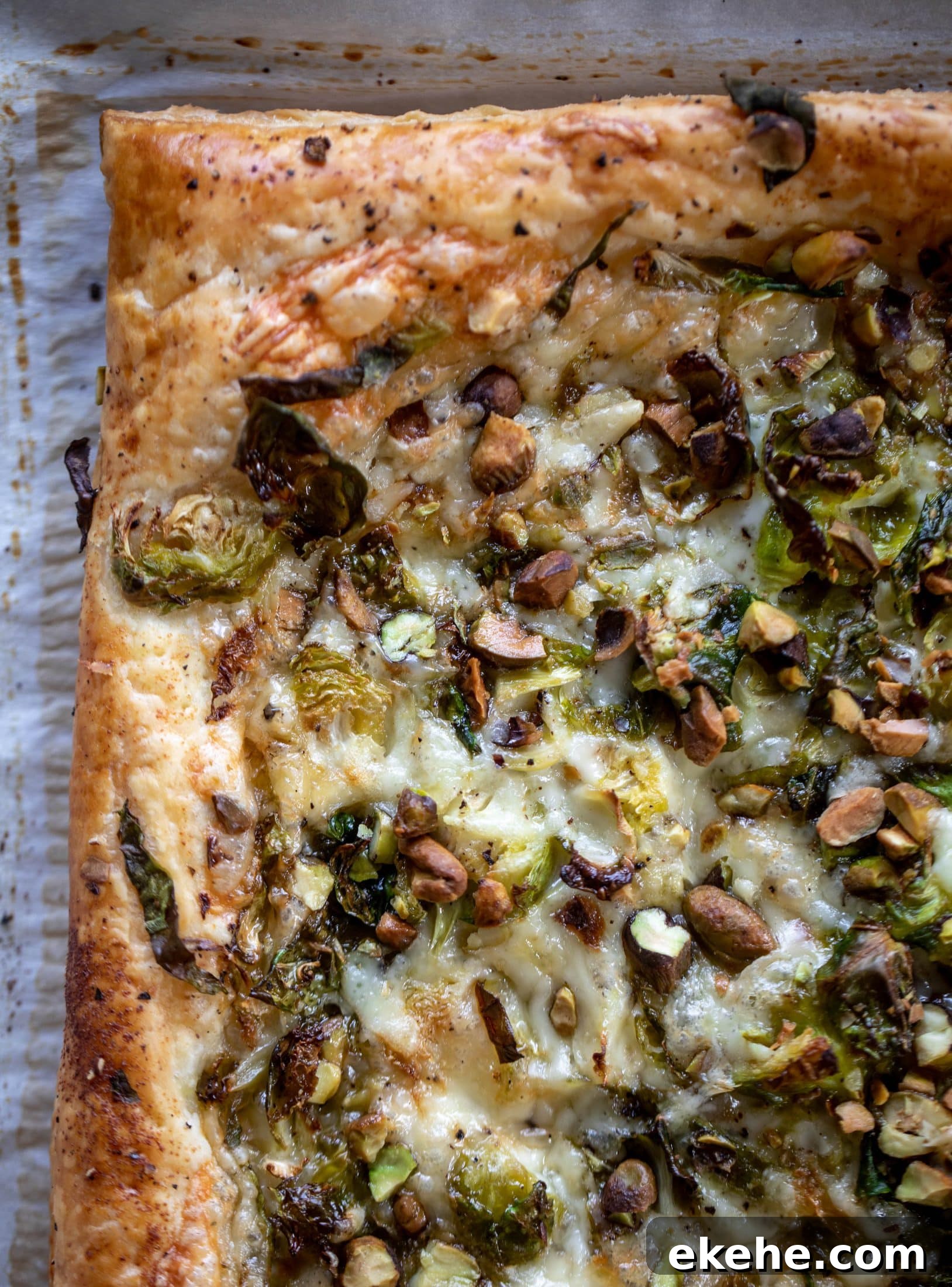 This brussels sprouts tart has a ton of flavor! Melty fontina, sliced brussels and crunchy pistachios all on top of puff pastry. Delish!