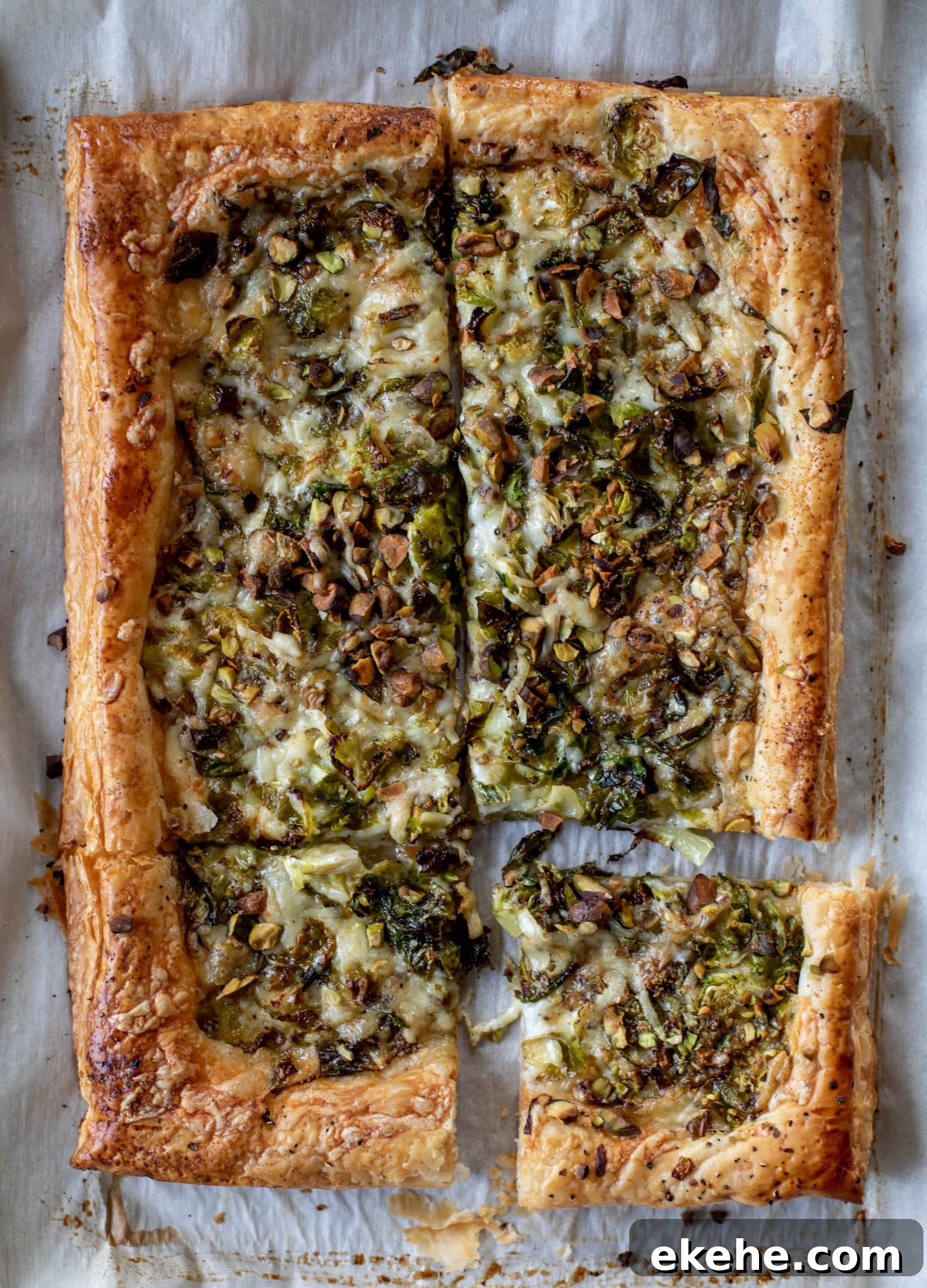 This brussels sprouts tart has a ton of flavor! Melty fontina, sliced brussels and crunchy pistachios all on top of puff pastry. Delish!