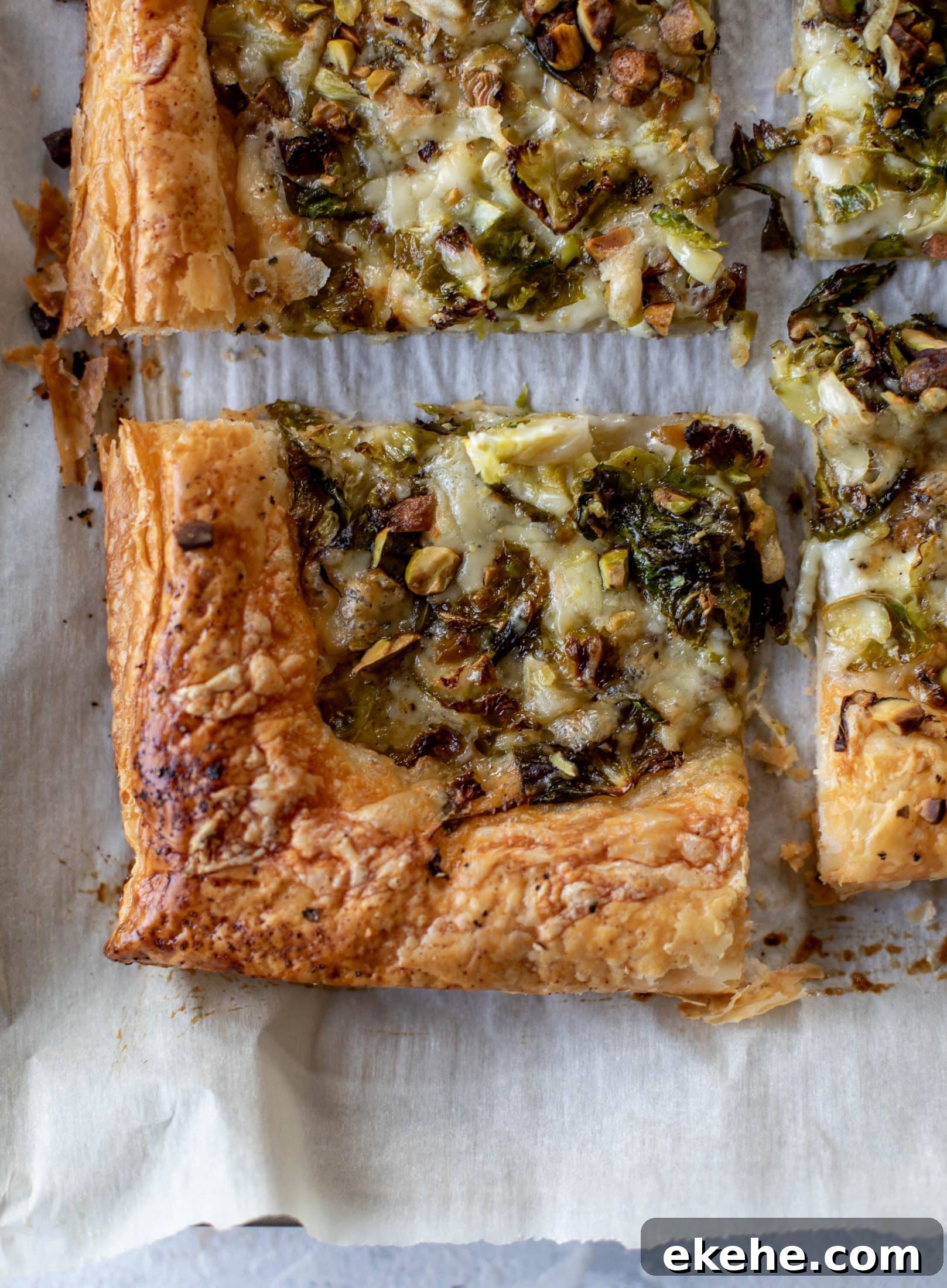 This brussels sprouts tart has a ton of flavor! Melty fontina, sliced brussels and crunchy pistachios all on top of puff pastry. Delish!
