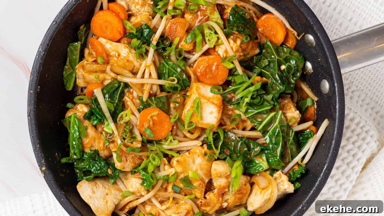 Stir-fried chicken chop suey in a skillet.