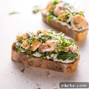 Baked salmon, lemon, crusty bread, fresh dill, Greek yogurt, shallot, and arugula make this salmon tartine one delicious open-faced sandwich! Ready in 20 minutes.