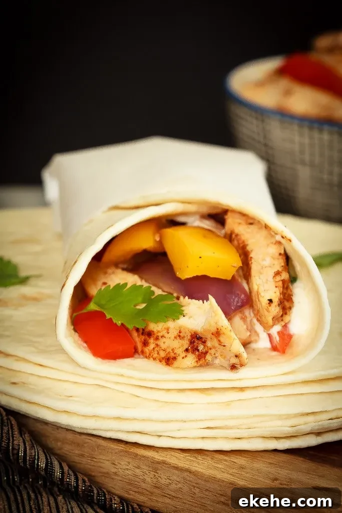 Quick and easy chicken fajitas with just one sheet pan to clean afterwards! This is my new favourite way to make one of my family's favourite meals!