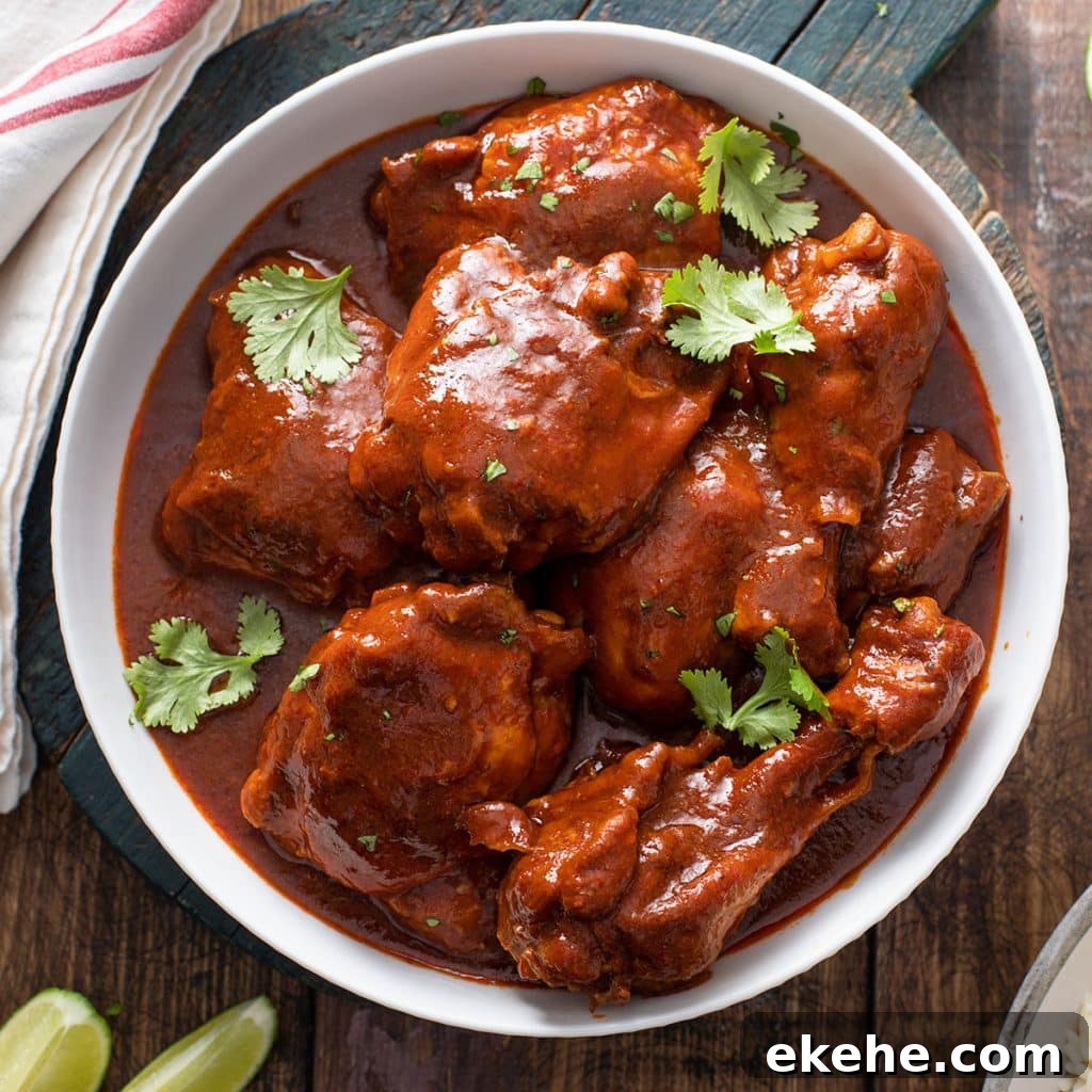 Mexican adobo chicken (Pollo adobado) in a white bowl