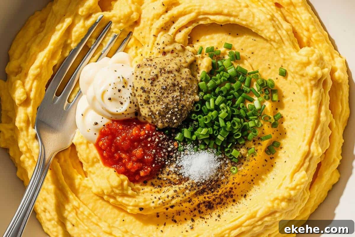 Mashed yolks with mayonnaise, Dijon mustard, Tabasco, salt, pepper, and chives.