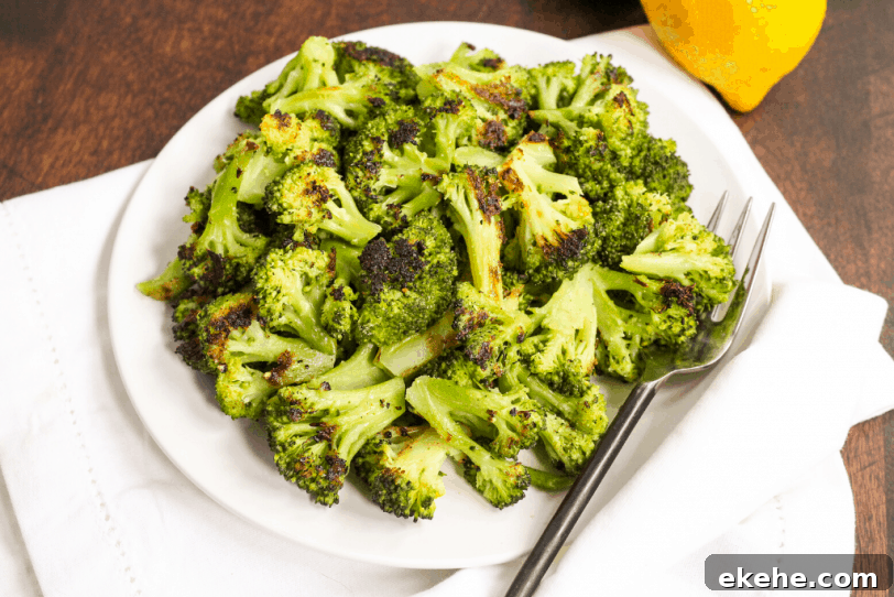 roasted broccoli on a plate with lemons