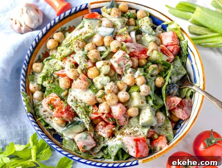 Tahini salad with chickpeas and cherry tomatoes in a bowl
