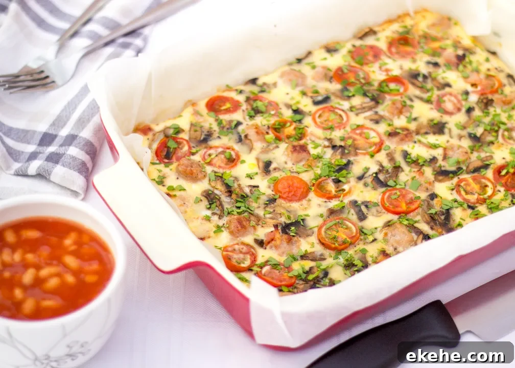 A full English baked frittata in a lined ovenproof dish scattered with fresh parsley