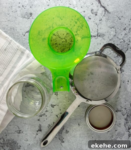 a wide mouth funnel, a sieve, and a jar