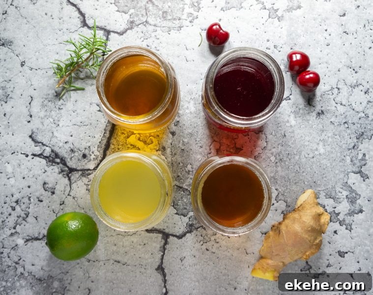 overhead of 4 jars of infused simple syrup