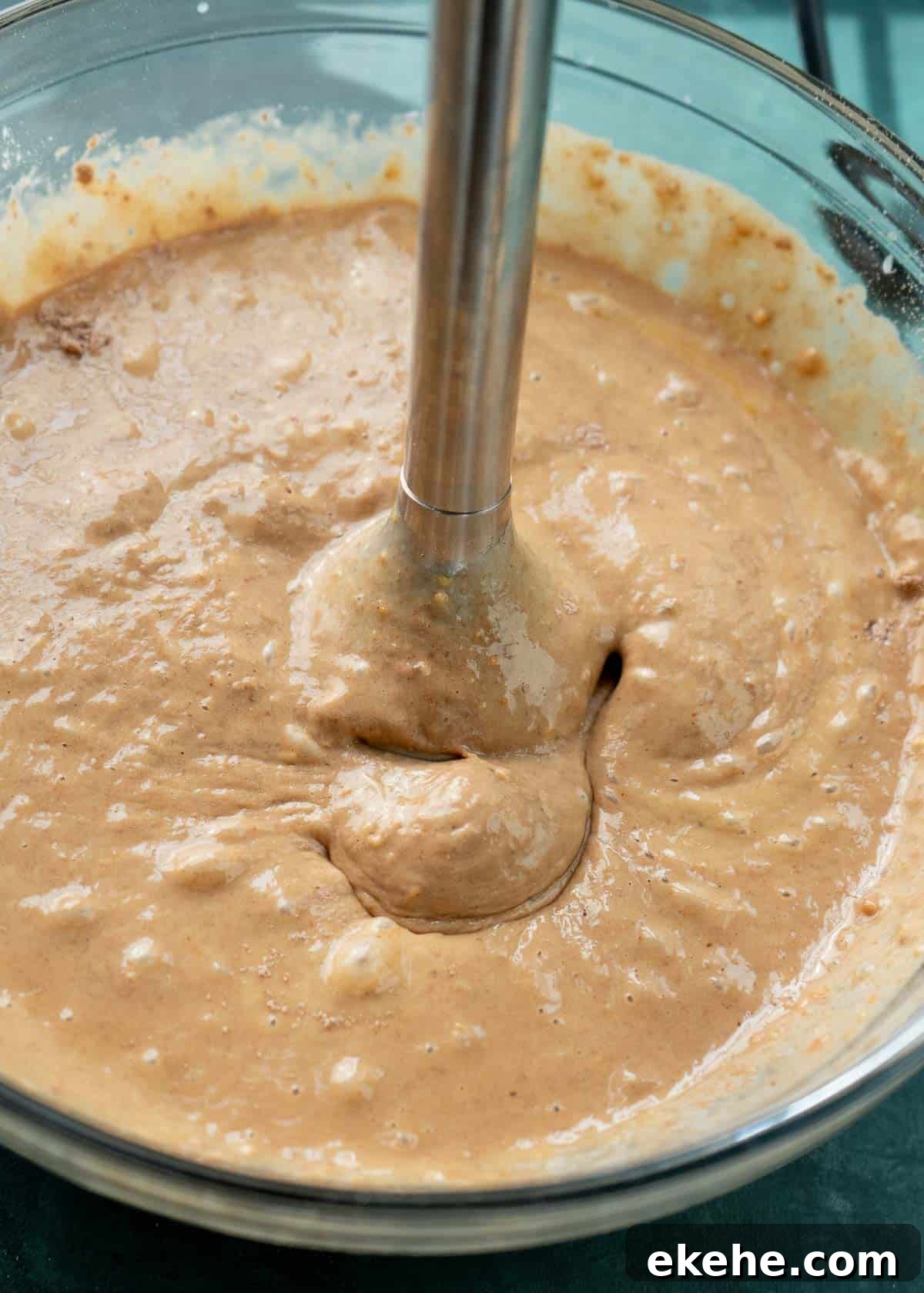 an inversion blender mixing the protein waffle ingredients in a glass bowl