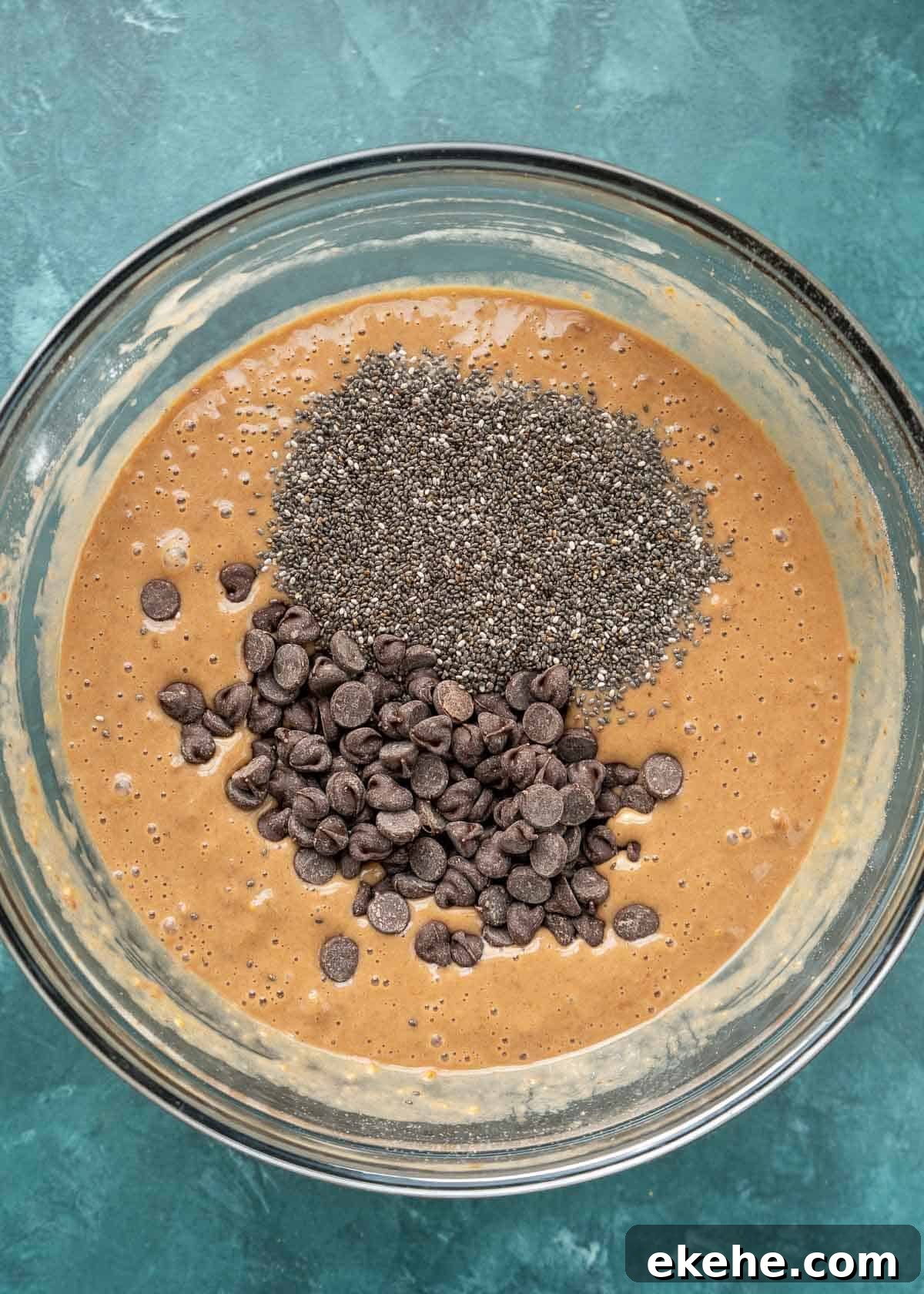 chia seeds and chocolate chips added to protein waffle batter