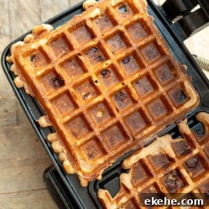 two square protein waffles in a waffle iron