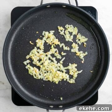 Sautéed garlic and onion in a skillet.
