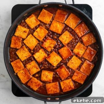 Cooked spicy tofu in a skillet.