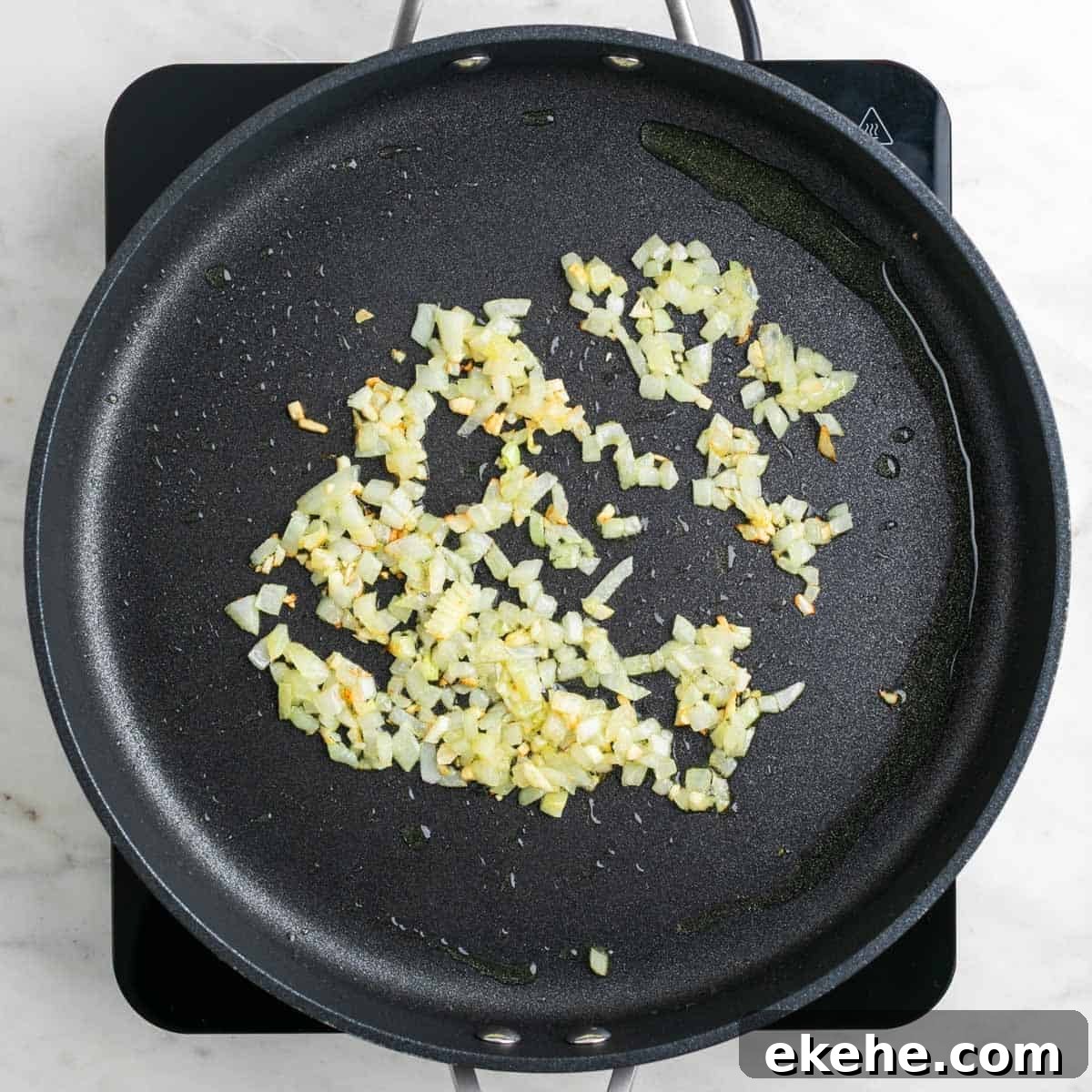Sautéed garlic and onion in a skillet.