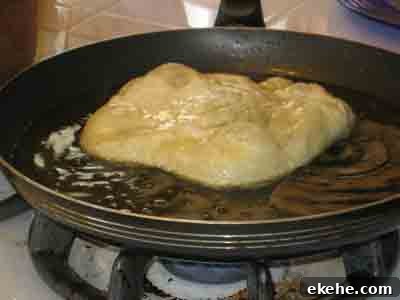 The dough is put in the oil.