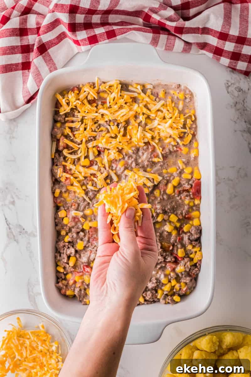 topping with the shredded cheese.