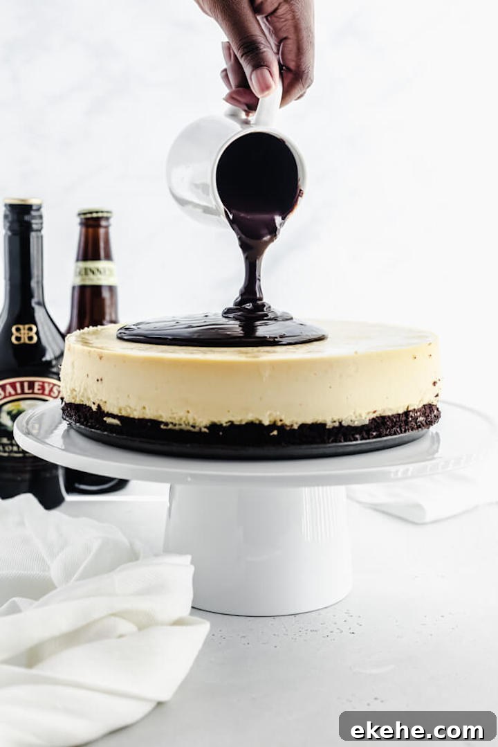 pouring ganache onto cheesecake