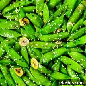 Stir fried sugar snap peas with sesame seeds, garlic, and soy sauce.