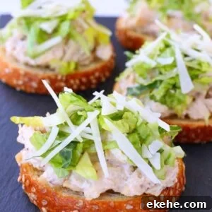 Caesar Chicken Salad is a chicken salad on a piece of toast with cheese and lettuce